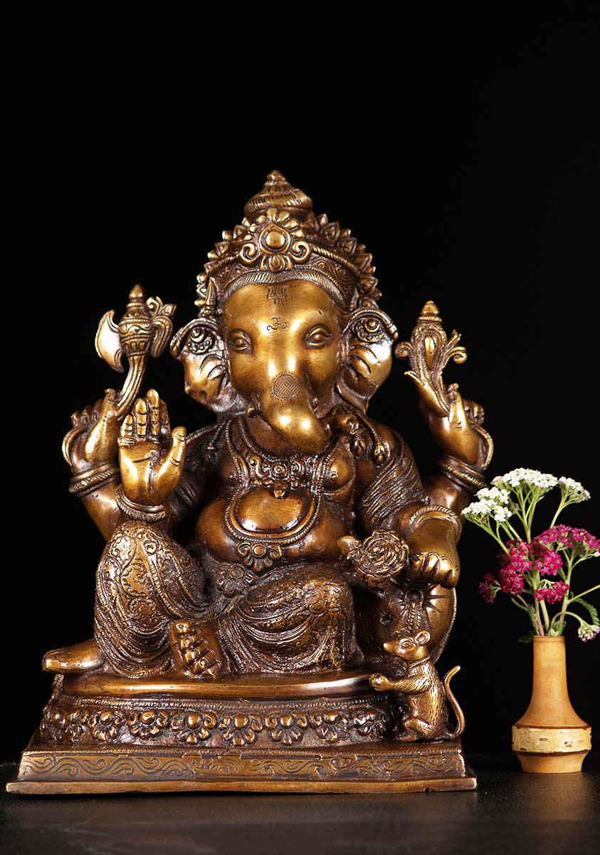 SOLD Brass Ganesh Statue Seated in Relaxed Posture Holding Lotus Flower ...