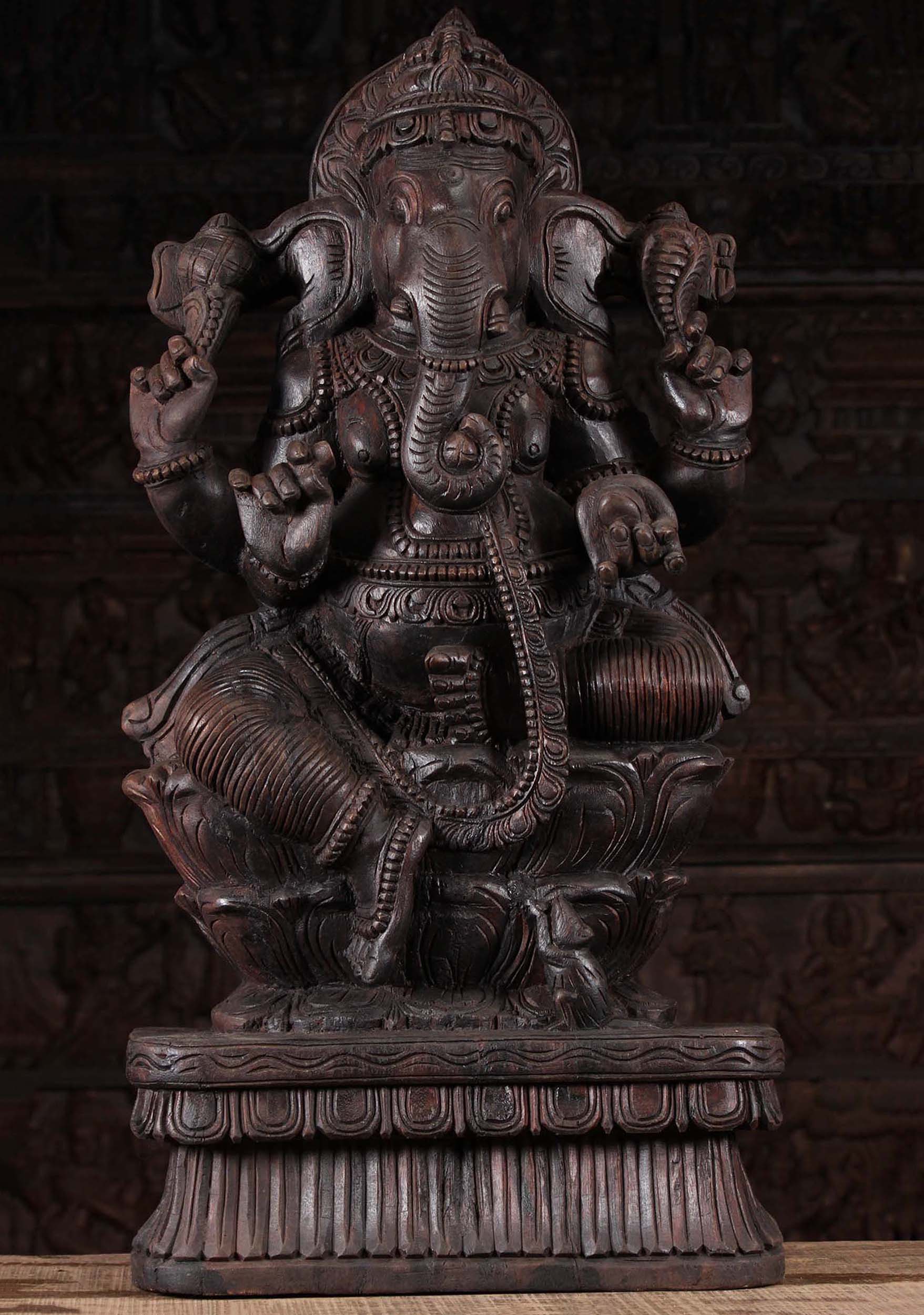 Dark Wood Seated Ganesh Holding Mango 36"