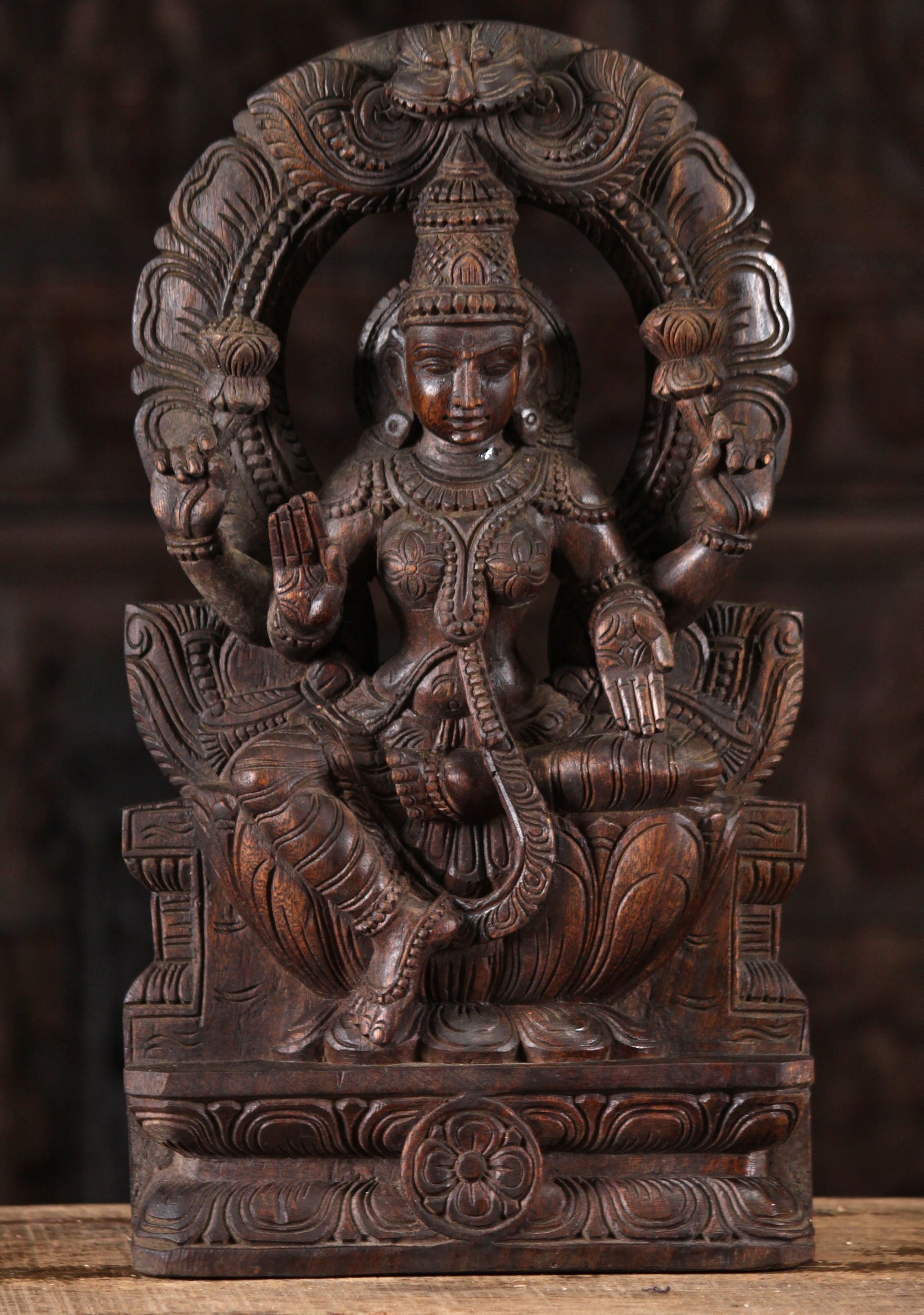 Wood Lakshmi Statue Seated Beneath Arch 18"