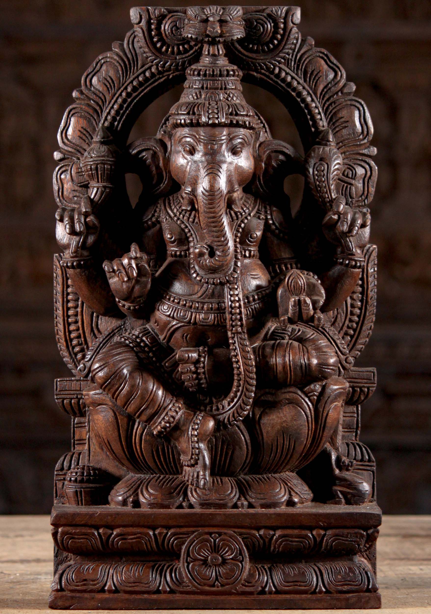 Wooden Ganesha Seated Under Arch with Mango 18"