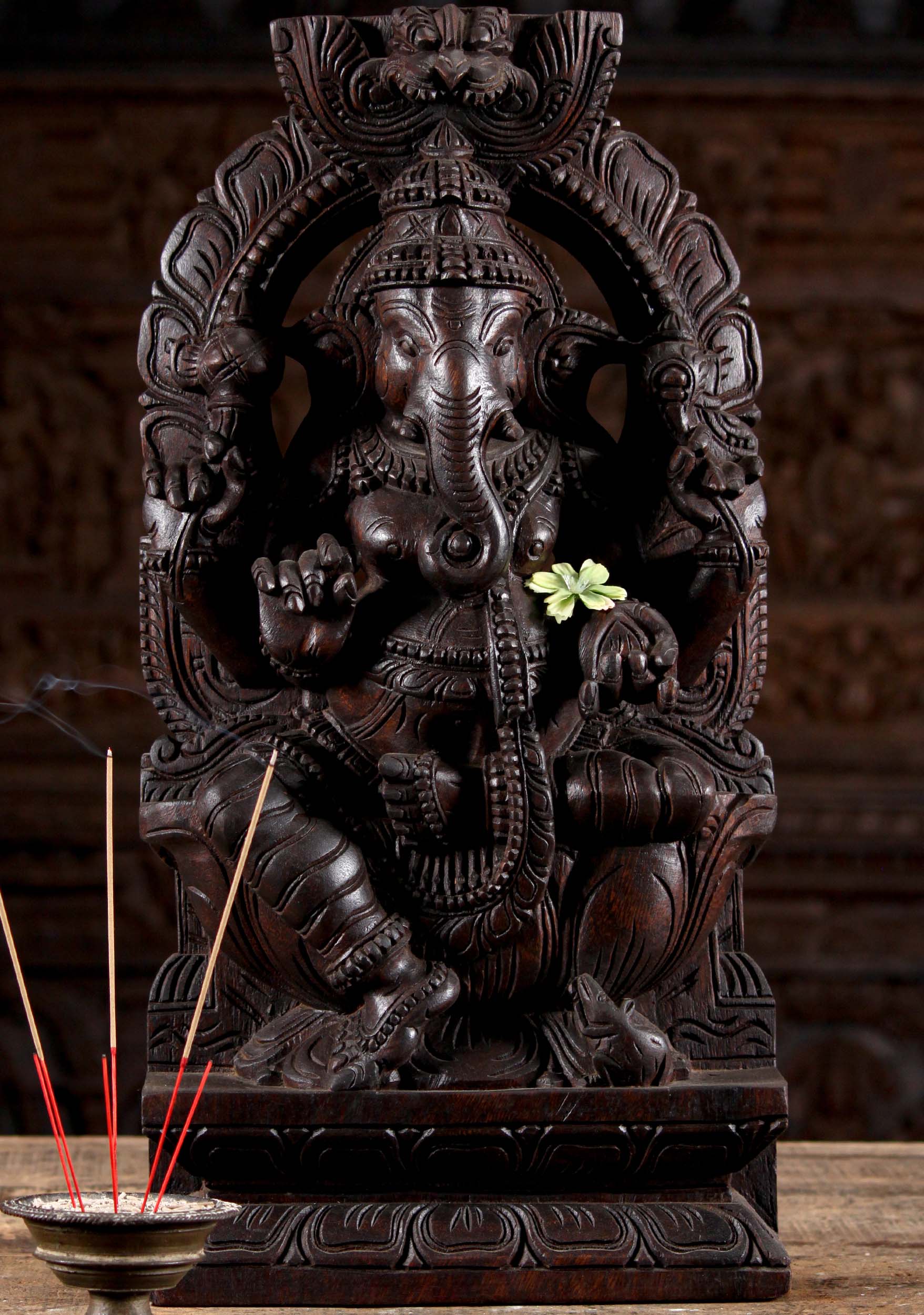 Wooden Seated Ganesha Under Arch with Mahakala  Looming Above Holding Broken Tusk 24"