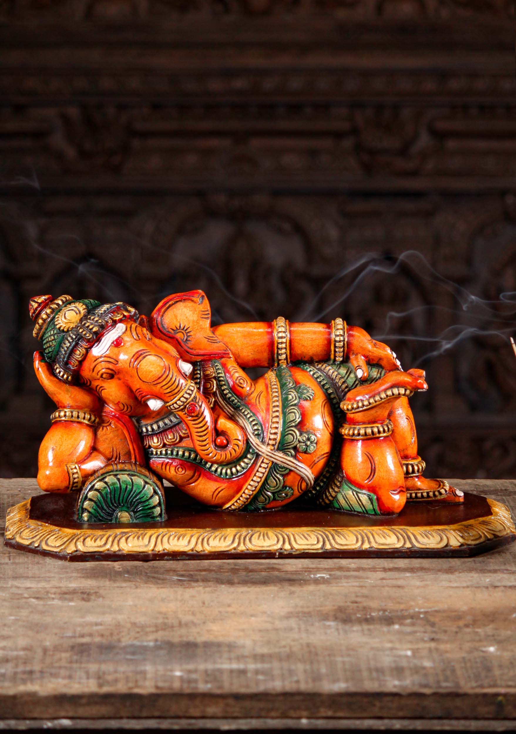 Wooden Orange Ganesh Statue in a Completely Relaxed Pose Reclining on a Pillow 20"