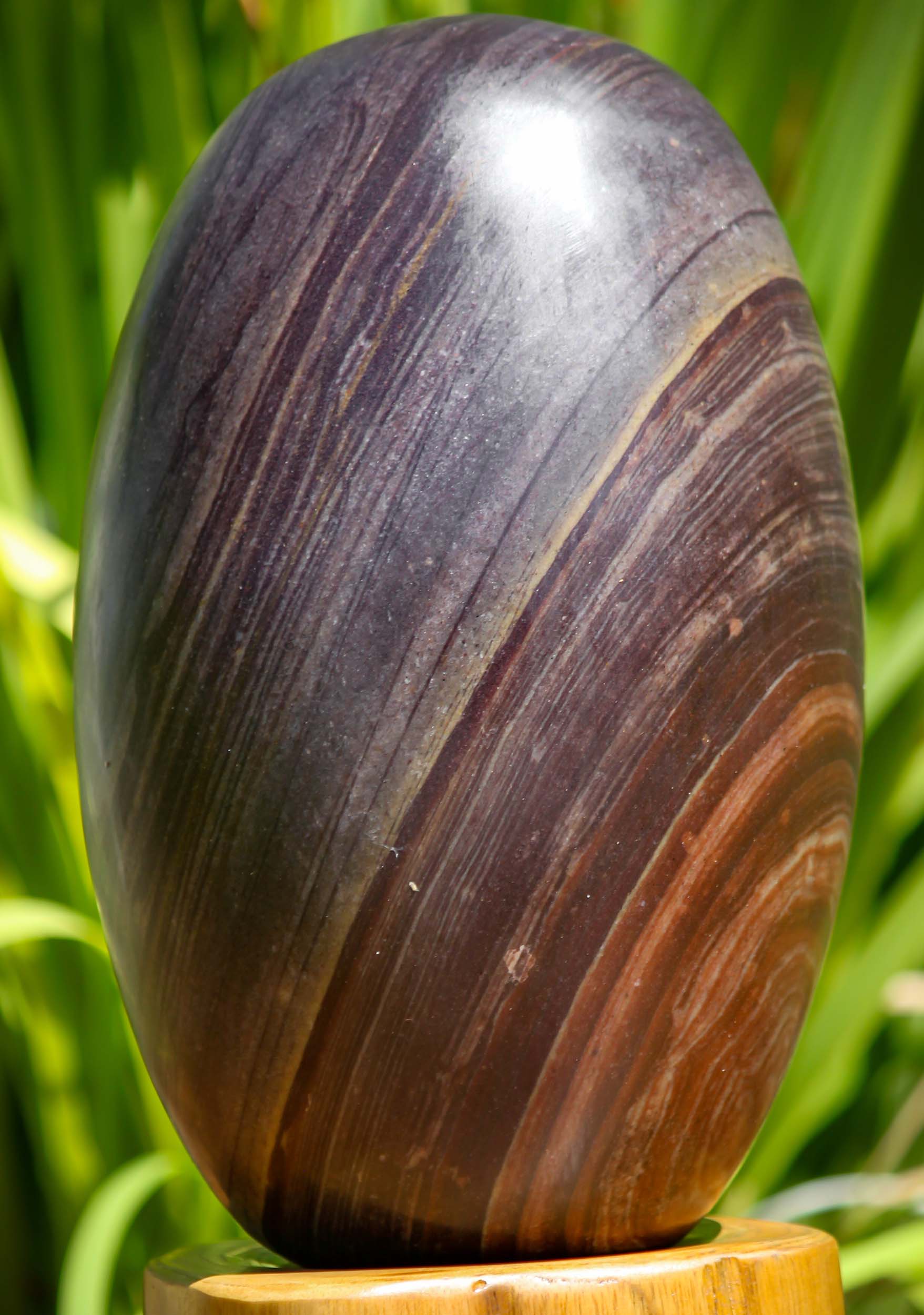 Dark Red and Purple Narmada Shiva Lingam with Rings Representing Shiva as a Pillar of Fire 9"