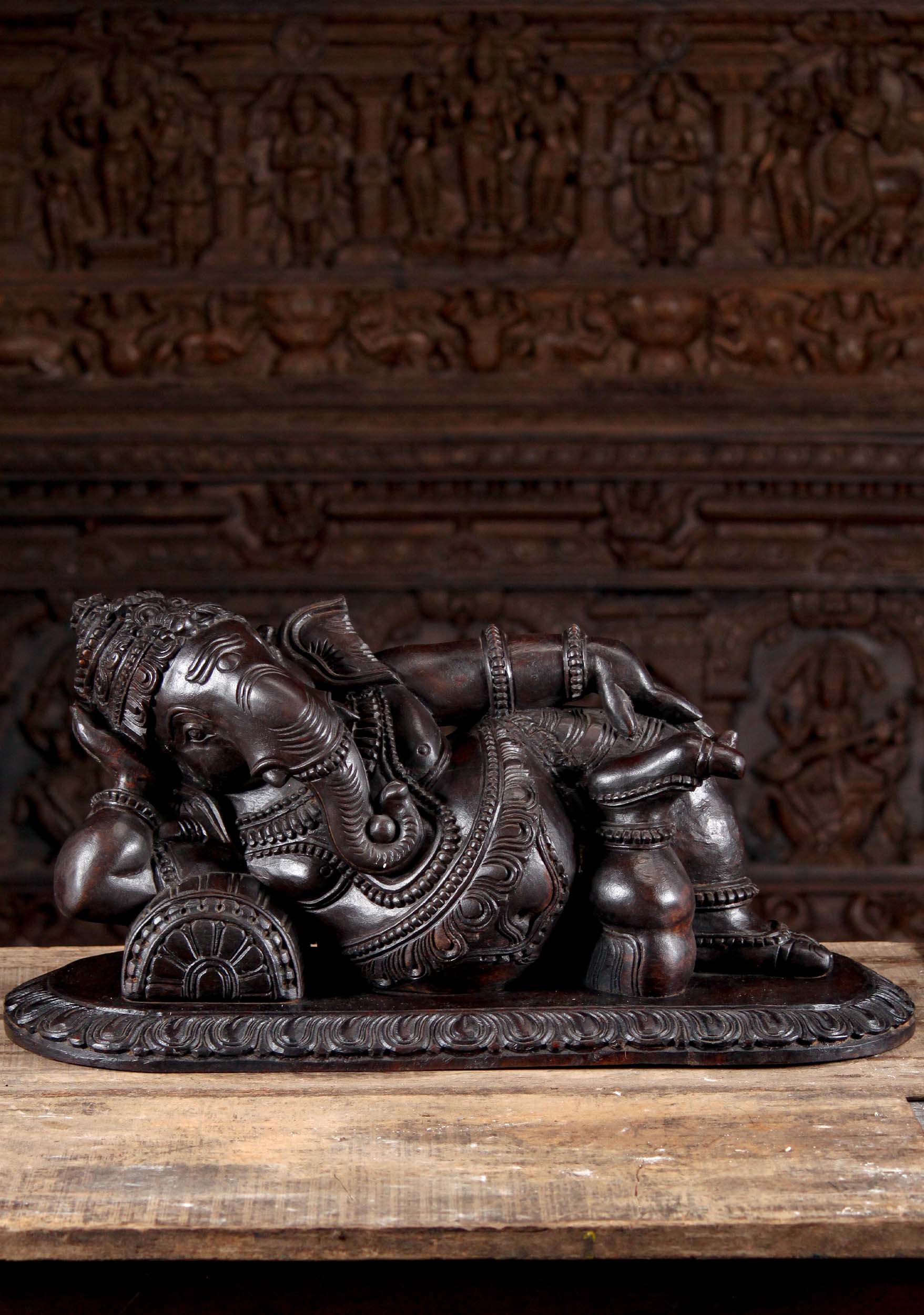 Dark Neem Wood Ganesh Statue in a Completely Relaxed Pose Reclining on a Pillow 29"