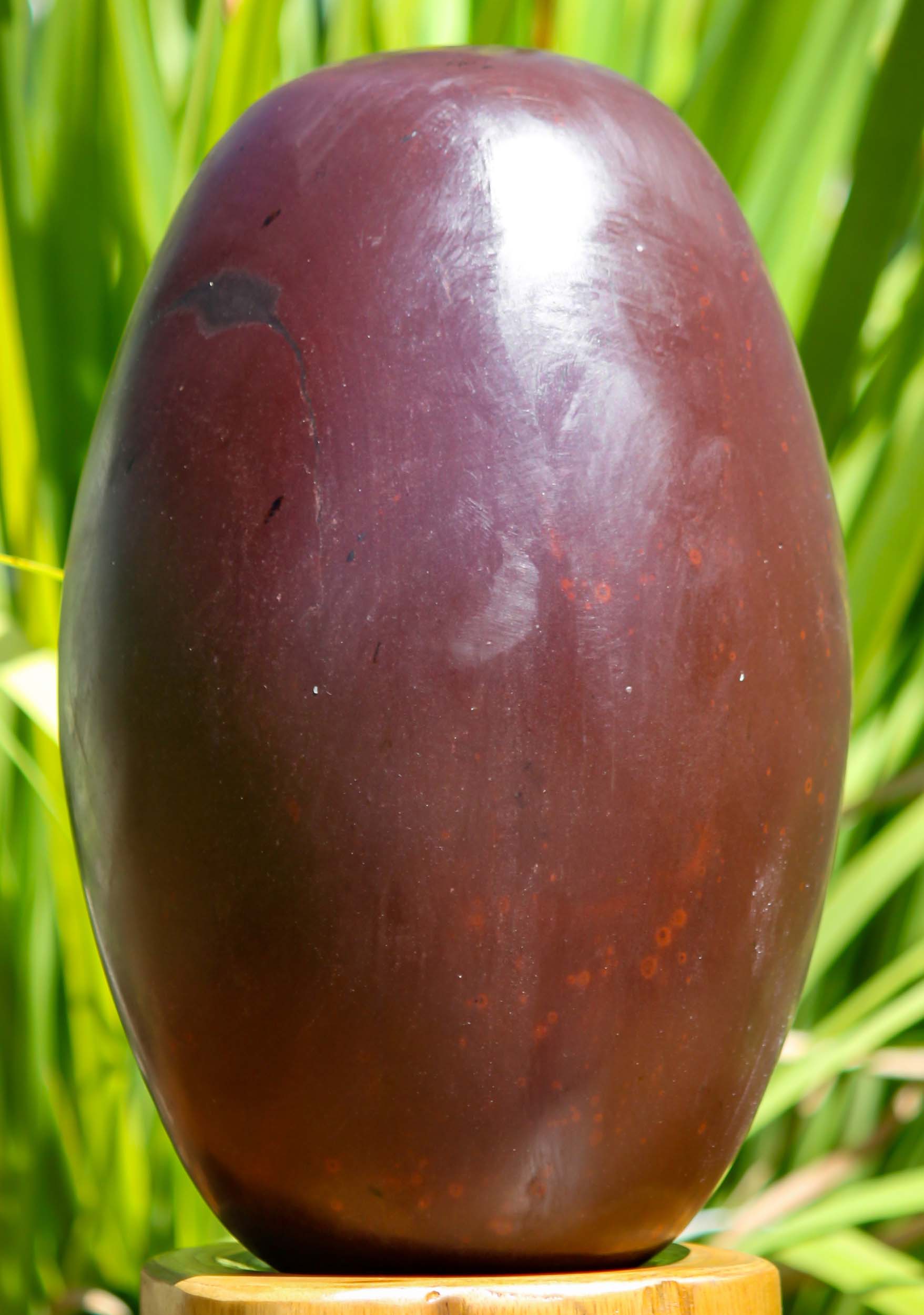 Red Narmada Shiva Lingam Stone with Lines Representing Shiva as a Pillar of Fire 10"