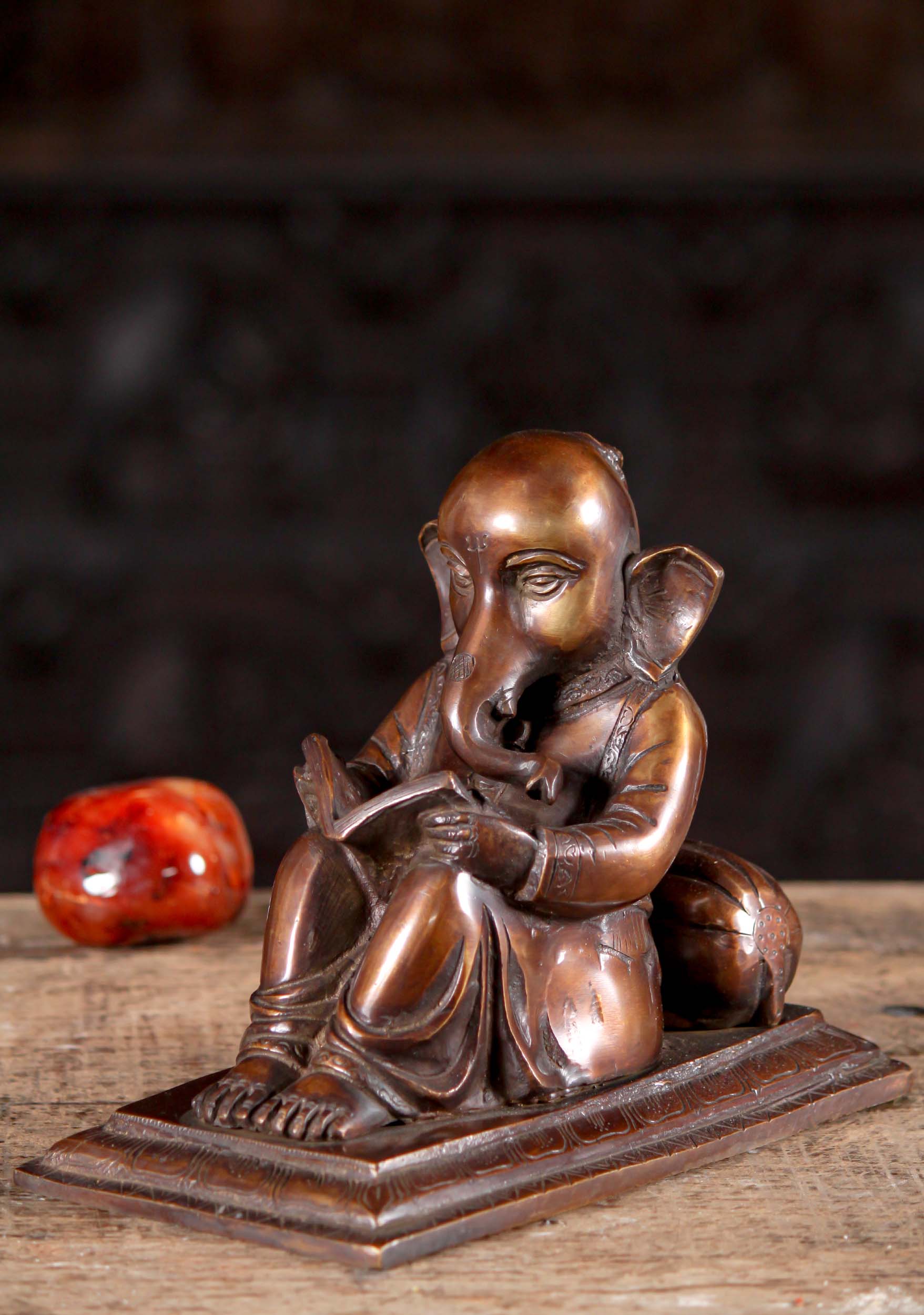 Brass Sculpture of Lounging Ganesha Resting on Pillow Reading a Book 8"