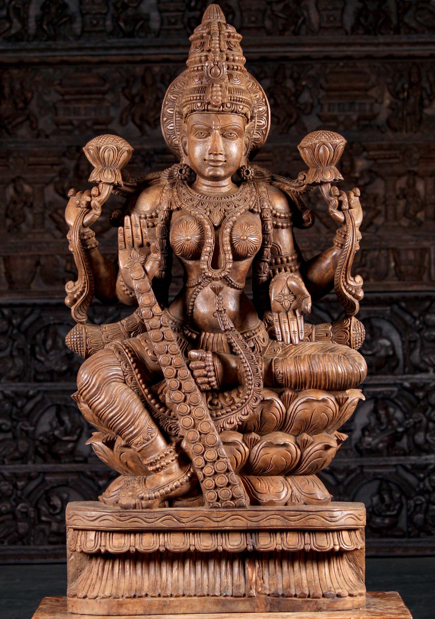 Wooden Seated Lakshmi Sculpture Holding Two Lotus Flowers Granting Boons with Coins 48"