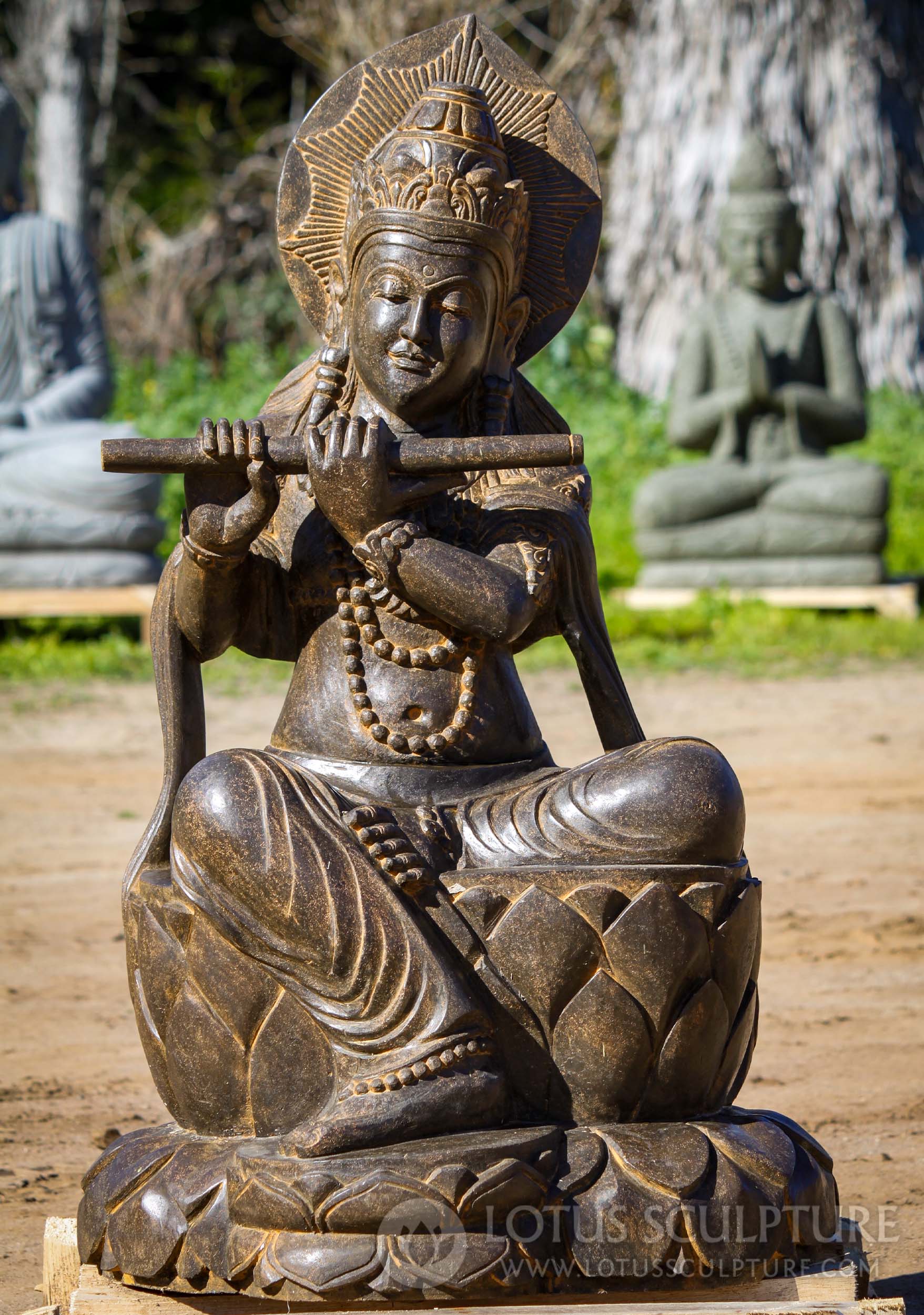 Stone Seated Saffron Krishna Playing the Flute with Chakra Halo Hand Carved in Java 41"